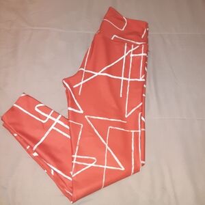 Stylish Coral Leggings with White Geometric Print